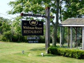 A view of the Whitman House Restaurant Sign showing our famous Model A Ford